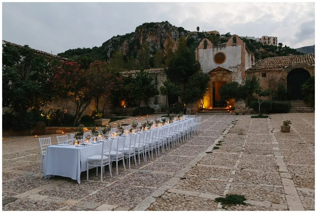 to get married in sicily: a wedding table in a stunning location near Trapani