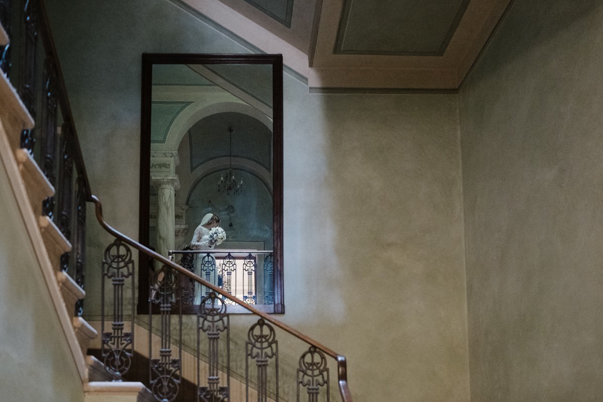 Interior staircase of the villa at Borgo Pignano, bride on the mirror
