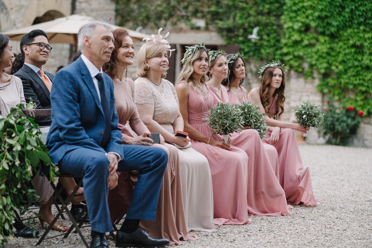 Bridesmaids in pink during the ceremony