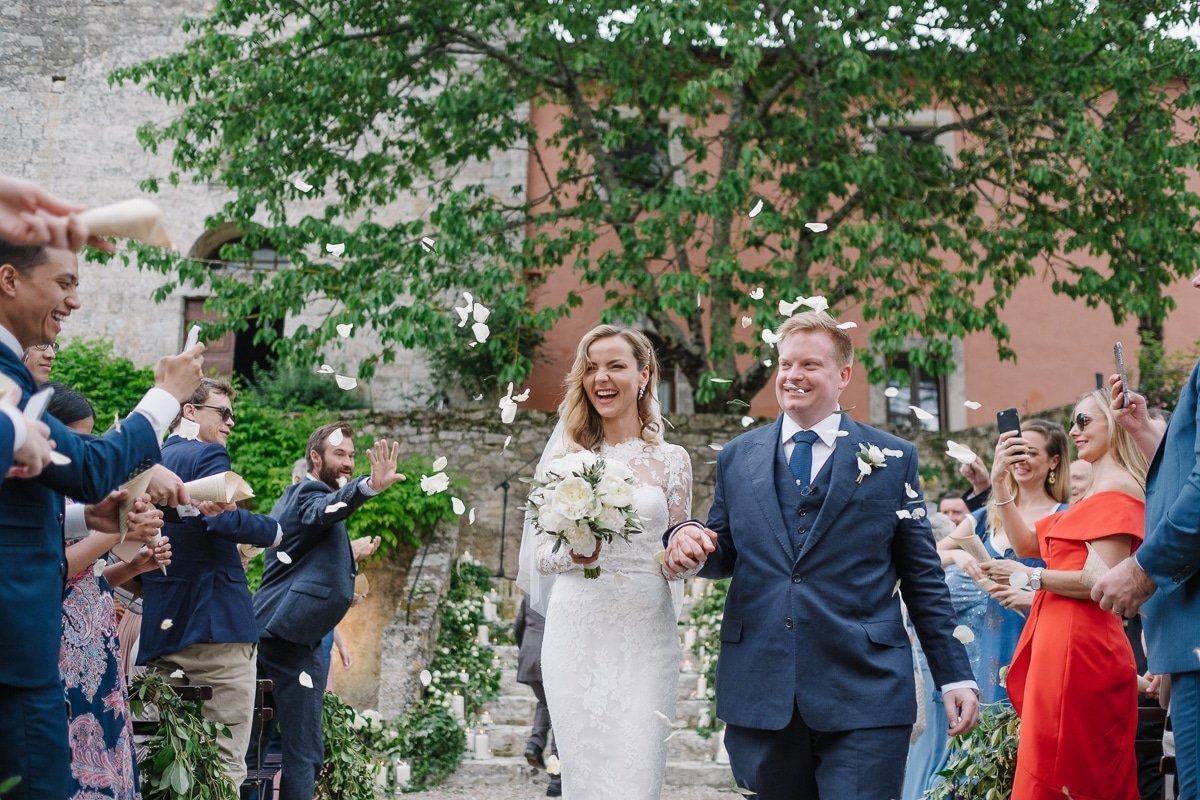 Ellie and Chad walking back down the aisle as newlyweds