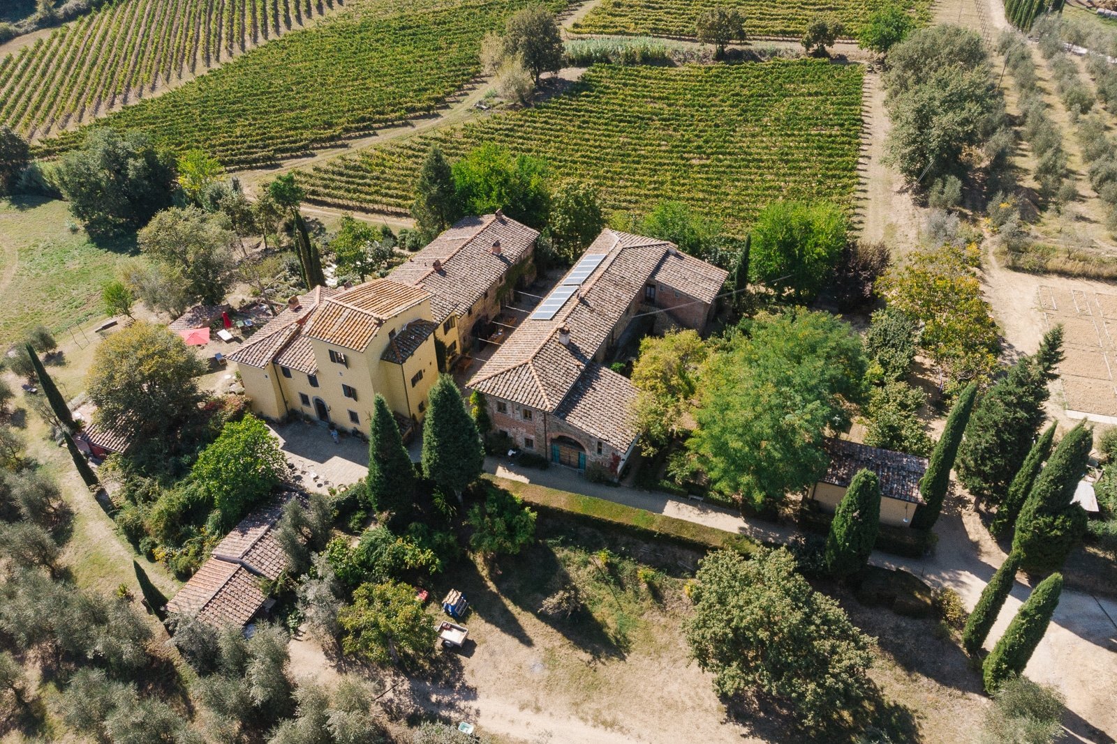 Aerial view of Locanda Casanuova among vineyards and olive groves