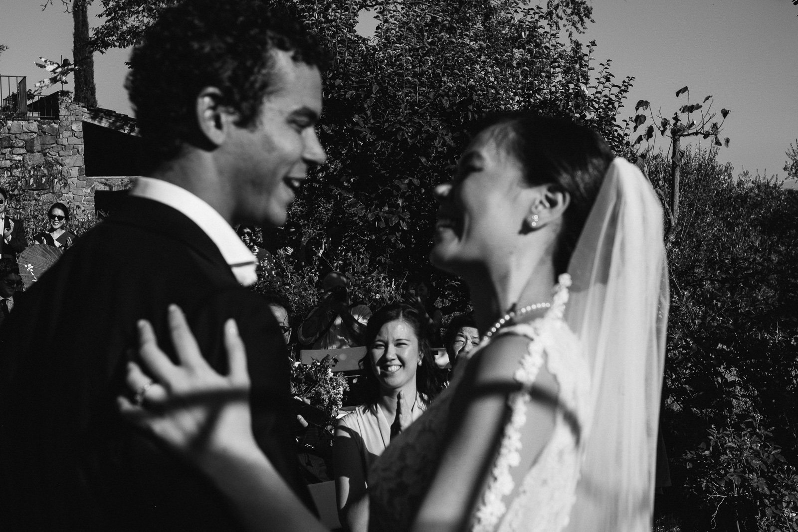 Aileen and Brandon during the ceremony, black and white