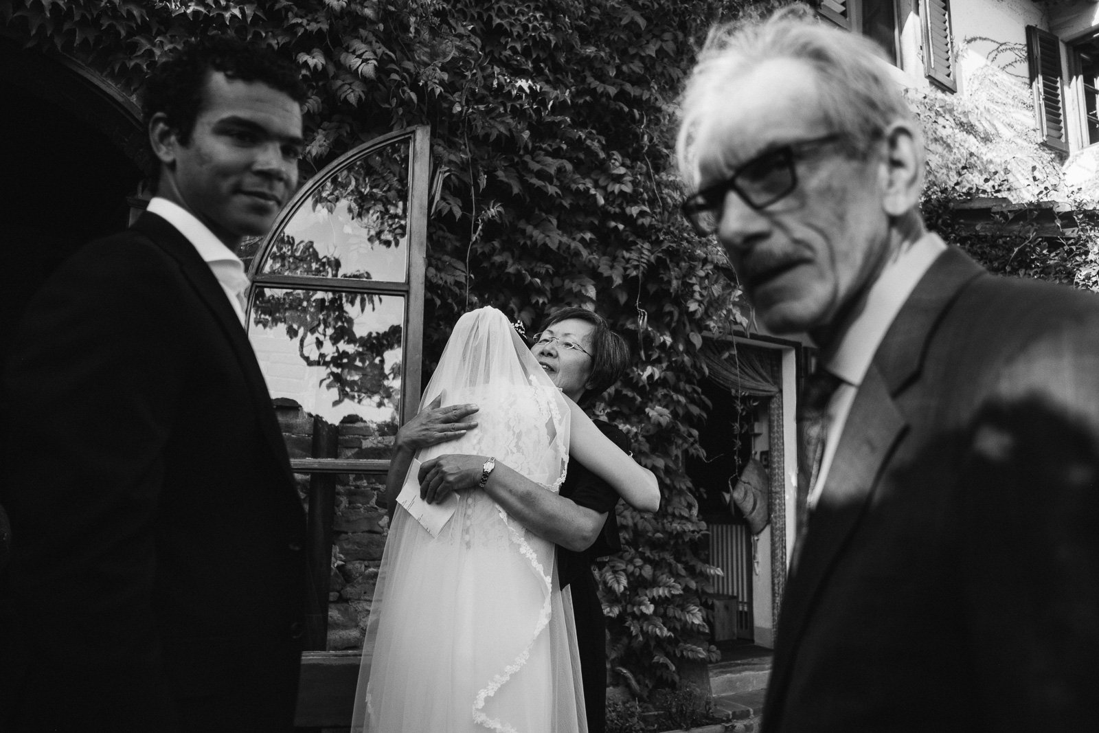 Guests congratulating the couple, black and white