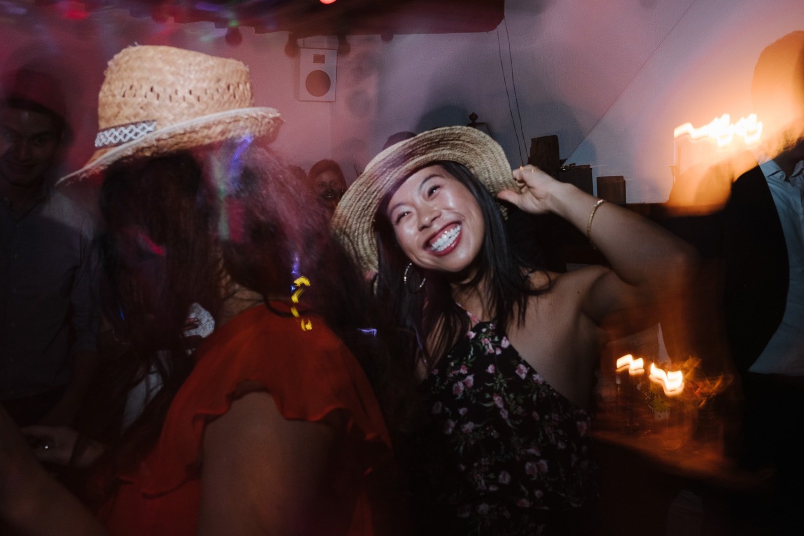 Guest dancing with a hat