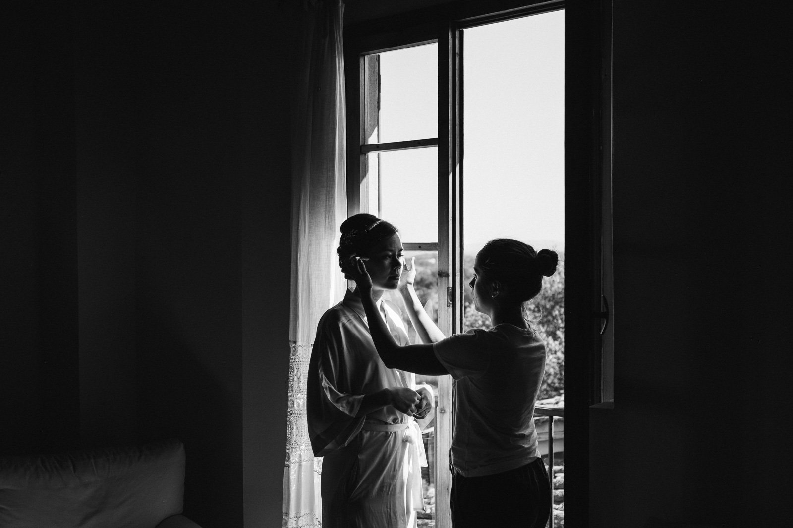 Bride by the window, black and white