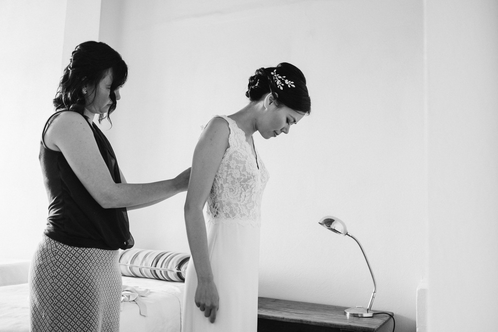 Bride's dress being buttoned