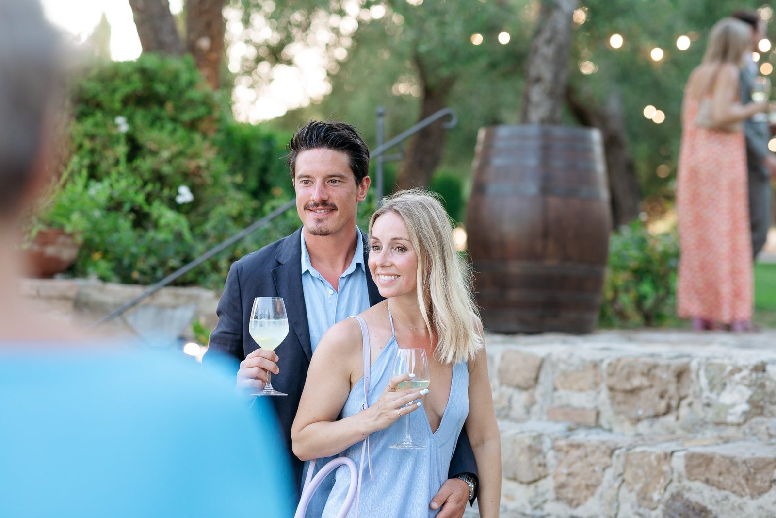 Guests at the aperitivo under the olive trees