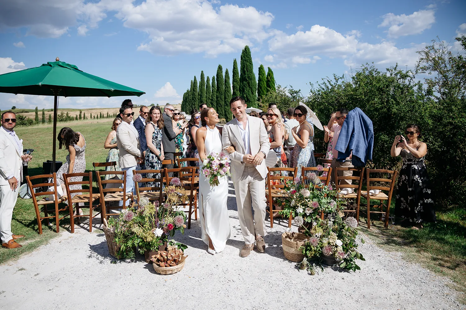 bride and groom after wedding ceremony at agritursimo il rigo san quirico d'orcia, tuscany