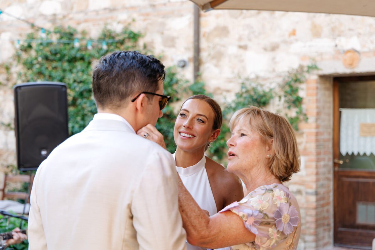 Groom embracing a mom after the ceremony