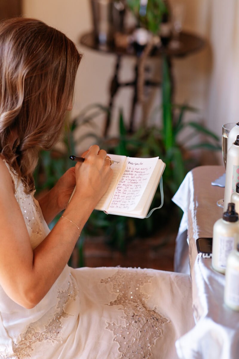 Bride writing vows before the ceremony