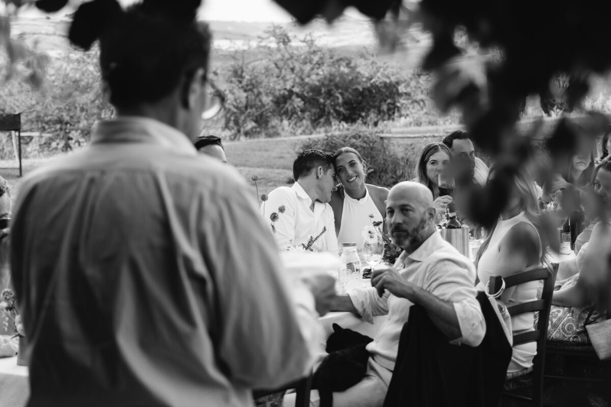 Guests at dinner, black and white
