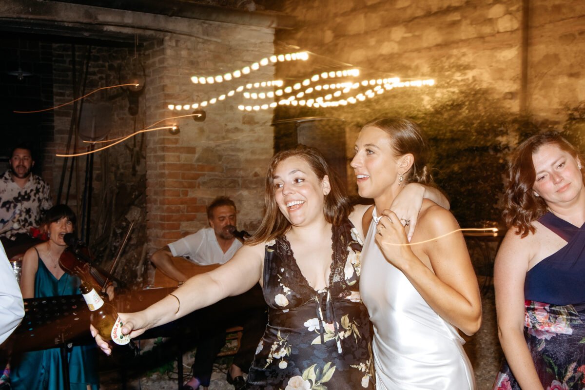 Guests dancing under the string lights