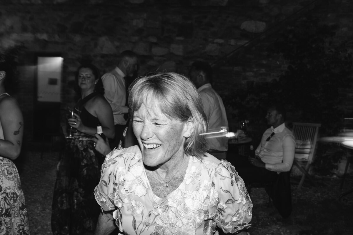 groom's mom dancing, black and white