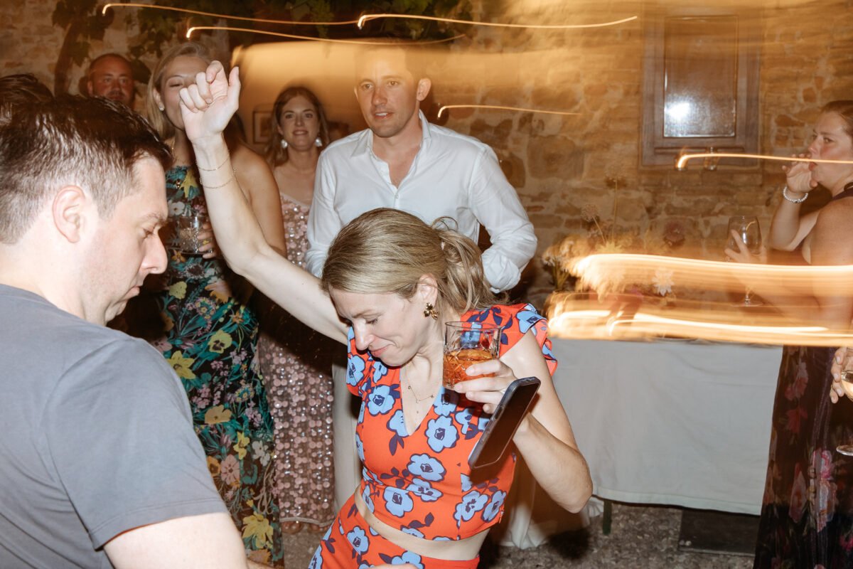 Guests dancing with arms raised
