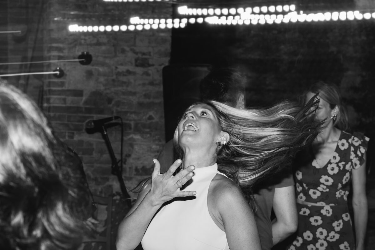 Hair flying on the dance floor, black and white