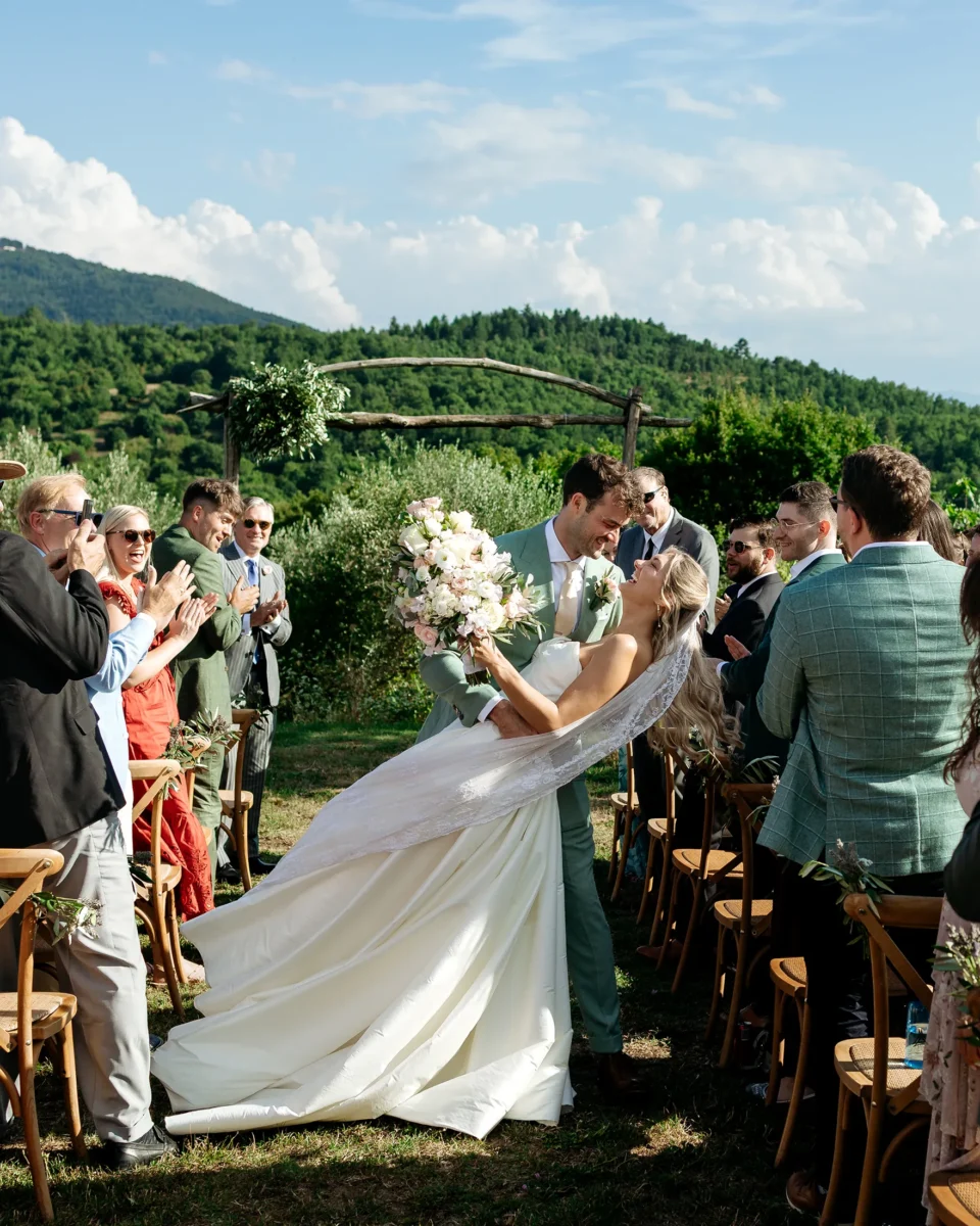 Bride and groom walking out after the ceremony at Castello di Ristonchi, Tuscany